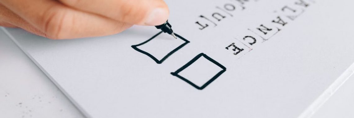 A hand drawing checkboxes on a checklist, themed around balance and burnout.